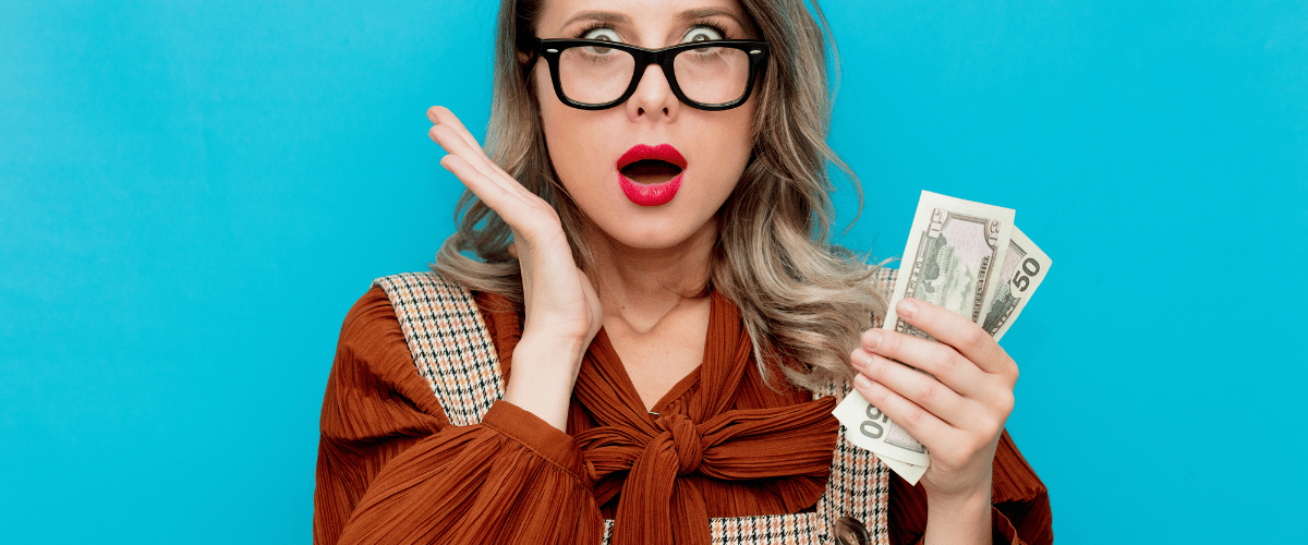 woman with glasses shocked money