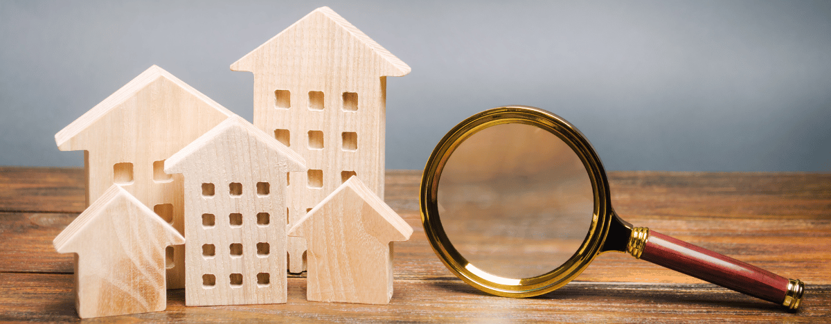 wood houses magnifying glass